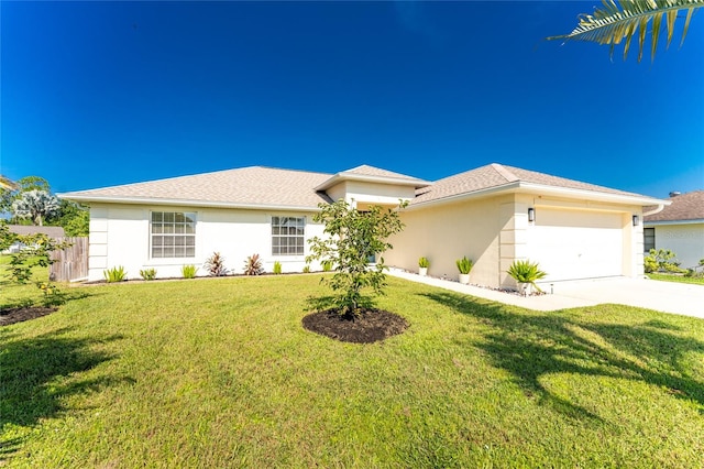 view of front of home with a garage and a front yard