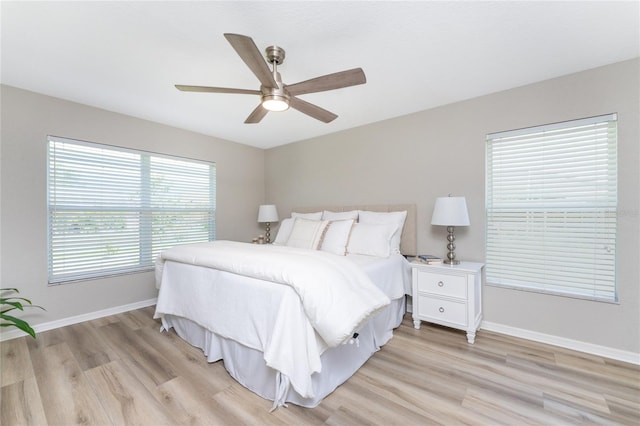 bedroom featuring light hardwood / wood-style floors and ceiling fan