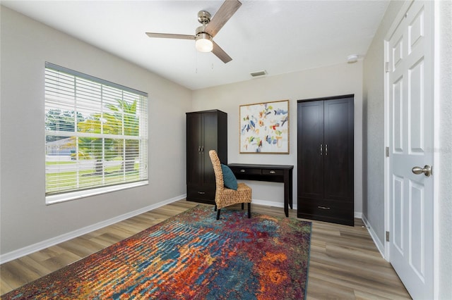 office area featuring light hardwood / wood-style flooring and ceiling fan