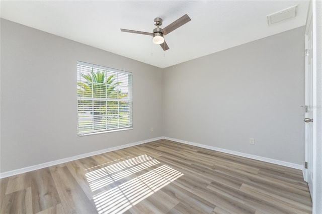 unfurnished room featuring ceiling fan and light hardwood / wood-style floors