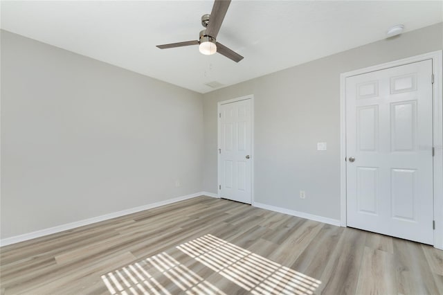 unfurnished bedroom featuring ceiling fan and light hardwood / wood-style floors