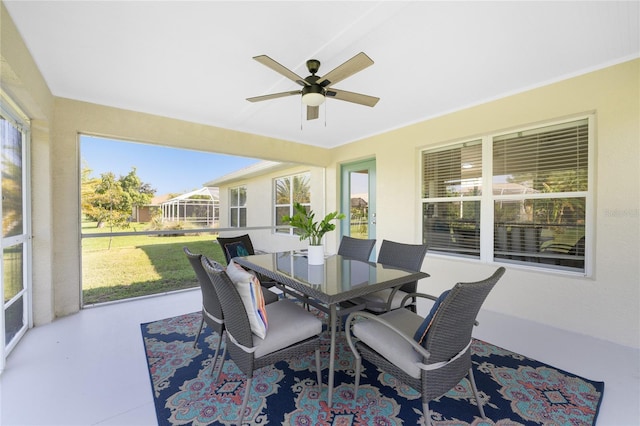 sunroom with ceiling fan