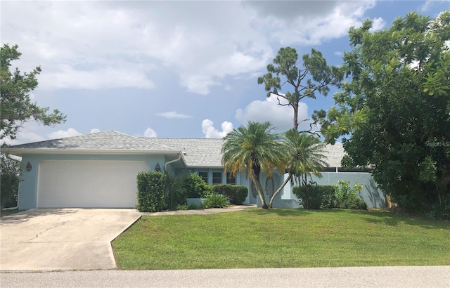 single story home with a front yard and a garage