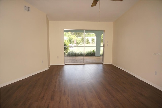 unfurnished room with ceiling fan and dark hardwood / wood-style floors