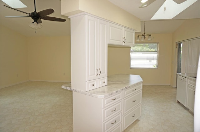 kitchen with ceiling fan, white cabinets, white dishwasher, and light tile patterned floors