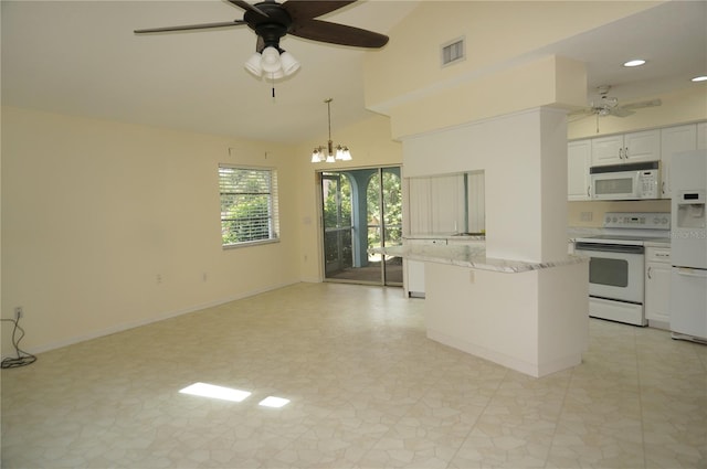 kitchen featuring ceiling fan with notable chandelier, white appliances, and light tile patterned flooring