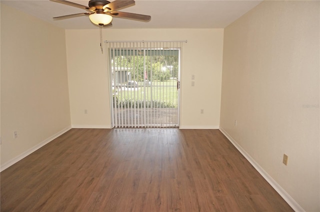 spare room featuring ceiling fan and dark hardwood / wood-style floors