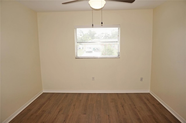 unfurnished room with ceiling fan and dark hardwood / wood-style flooring