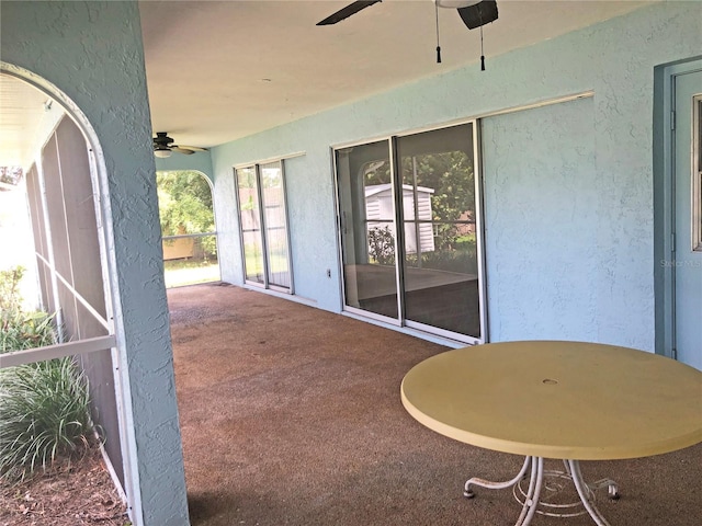 view of patio / terrace featuring ceiling fan