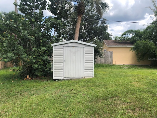 view of outbuilding featuring a yard