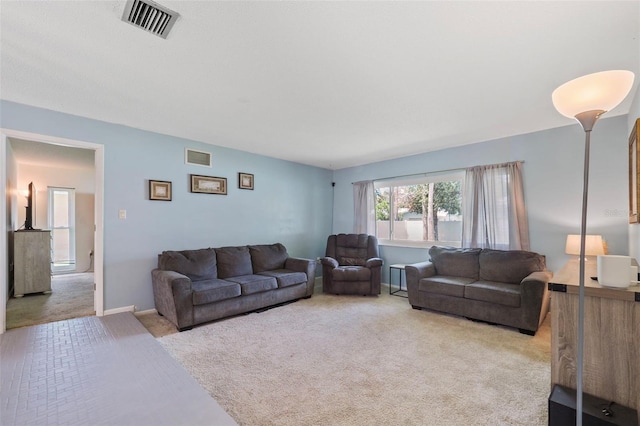 living room featuring light carpet