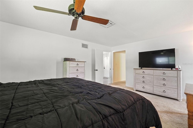 unfurnished bedroom with ceiling fan and carpet