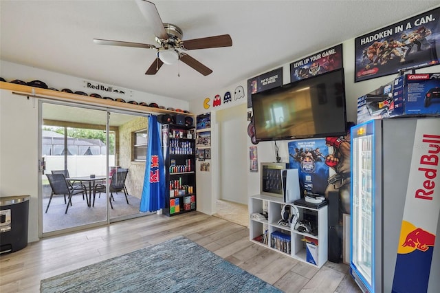 interior space featuring ceiling fan and light hardwood / wood-style flooring