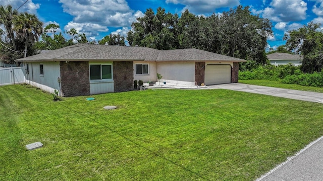 ranch-style home featuring a garage and a front lawn