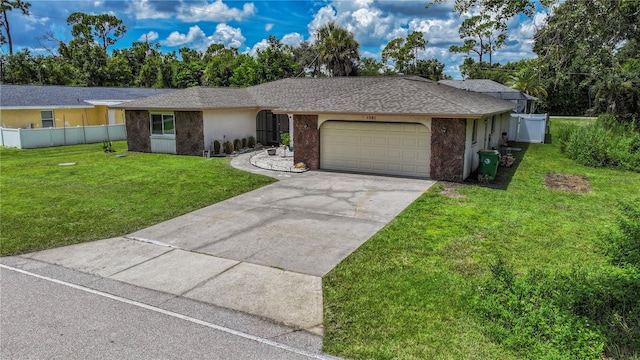 single story home with a garage and a front lawn