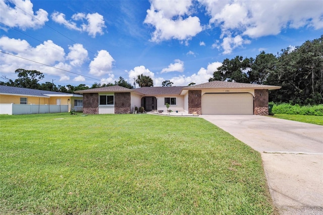 ranch-style house featuring a front yard and a garage