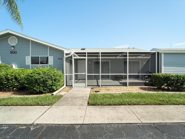 view of front of property featuring a sunroom