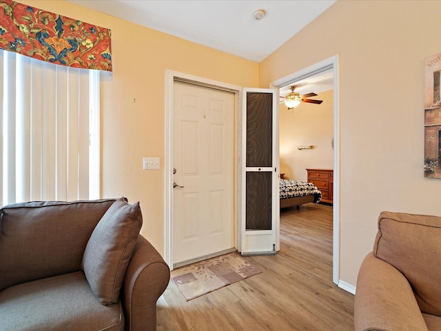 foyer entrance featuring ceiling fan and light hardwood / wood-style floors