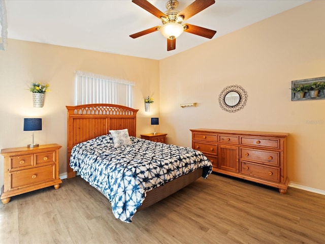 bedroom featuring ceiling fan and light hardwood / wood-style flooring