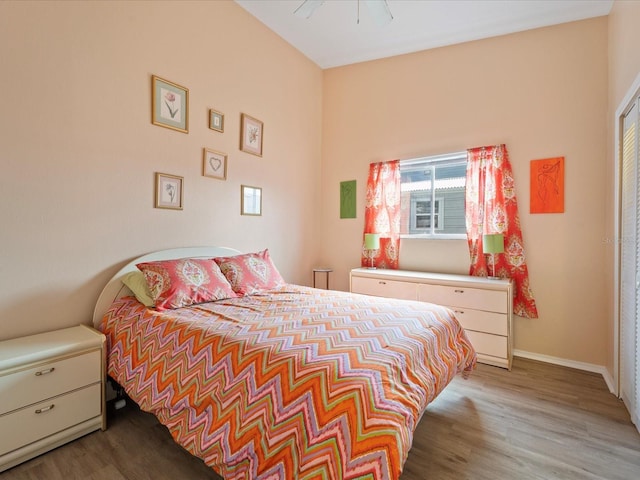 bedroom with ceiling fan and light wood-type flooring