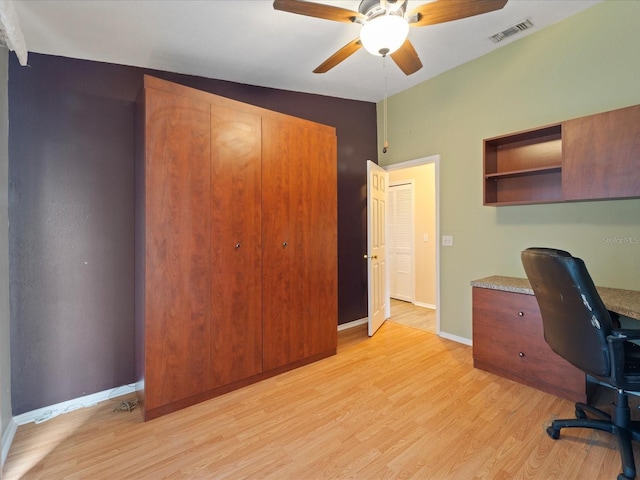 office with light hardwood / wood-style flooring, ceiling fan, and vaulted ceiling