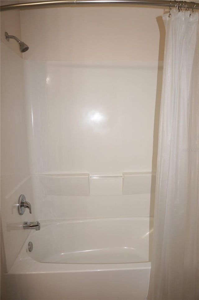 bathroom featuring shower / bath combination with curtain