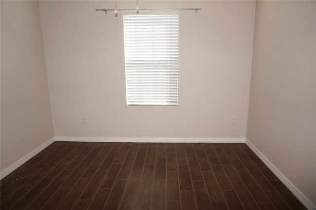 unfurnished room with hardwood / wood-style flooring