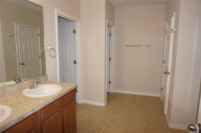 bathroom featuring double vanity and tile patterned floors