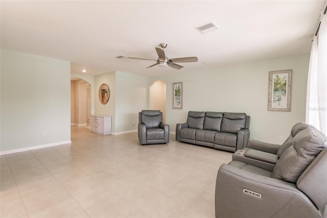 living room featuring ceiling fan and light tile patterned floors