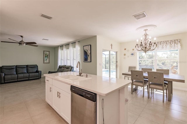 kitchen with an island with sink, white cabinets, dishwasher, sink, and decorative light fixtures