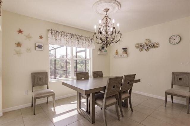 tiled dining space with a chandelier