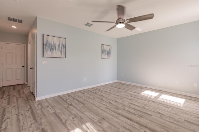 unfurnished room with ceiling fan and light hardwood / wood-style flooring