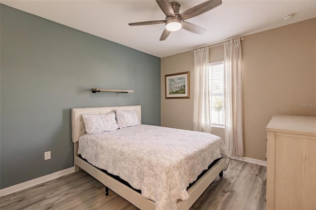 27261 Guapore Dr, Punta Gorda, FL 33983 - bedroom featuring wood finished floors, baseboards, and ceiling fan