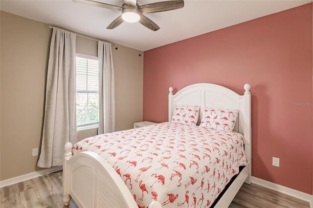 bedroom with ceiling fan and light hardwood / wood-style floors