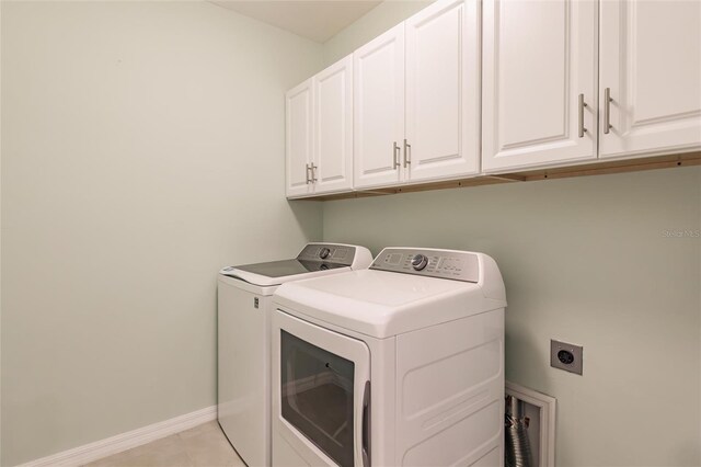27261 Guapore Dr, Punta Gorda, FL 33983 - washroom featuring cabinet space, washer and clothes dryer, and baseboards