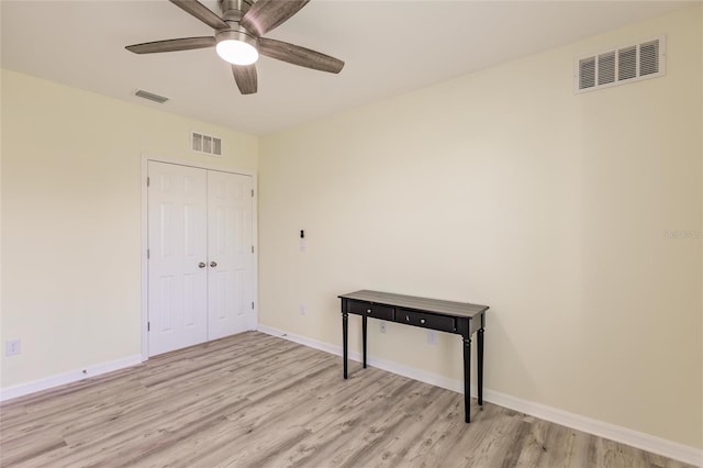 interior space with ceiling fan and light hardwood / wood-style flooring