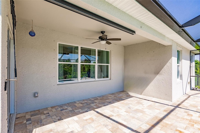 view of patio featuring ceiling fan