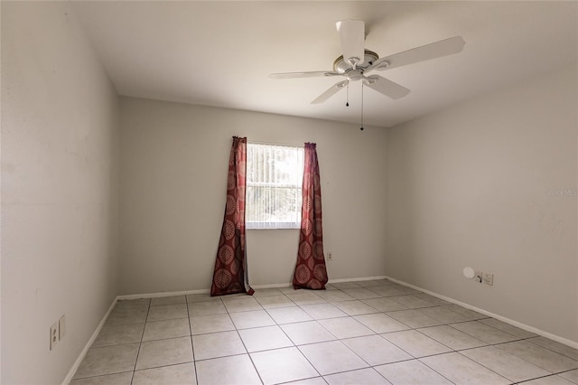 tiled empty room with ceiling fan