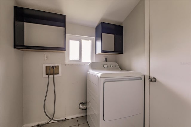 laundry area featuring washer / clothes dryer and light tile patterned floors