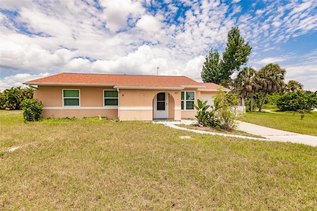 ranch-style house with a front lawn