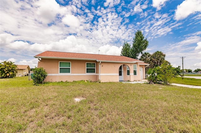 view of front of home with a front lawn