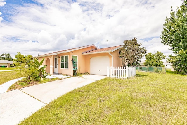 ranch-style house with a garage and a front lawn