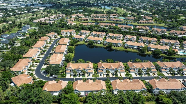 drone / aerial view with a residential view and a water view