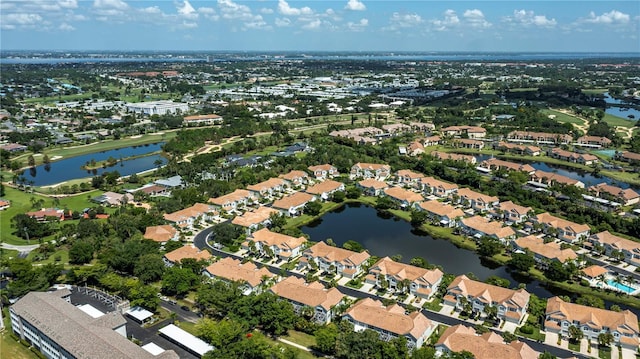 birds eye view of property featuring a residential view and a water view