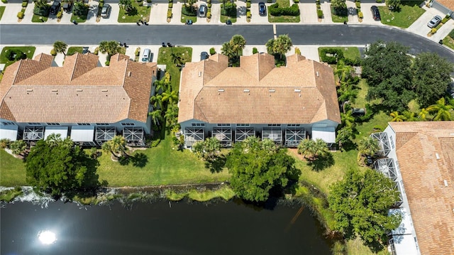 bird's eye view with a residential view and a water view