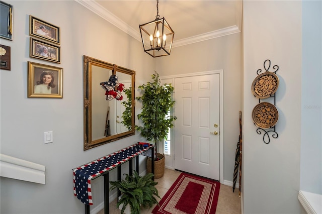 foyer entrance featuring baseboards, an inviting chandelier, and crown molding