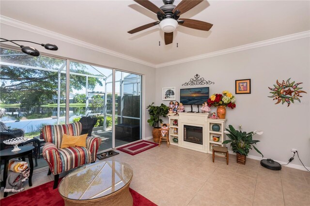 tiled living room with ceiling fan and crown molding