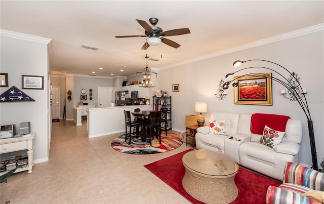 living room featuring crown molding, ceiling fan with notable chandelier, visible vents, and baseboards