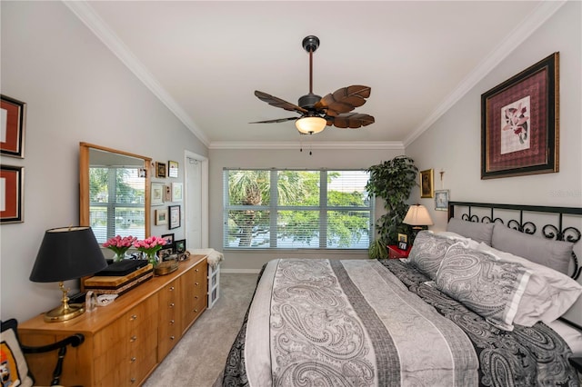 bedroom featuring light colored carpet, baseboards, crown molding, and ceiling fan