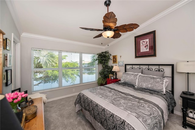 carpeted bedroom with ceiling fan, ornamental molding, and multiple windows